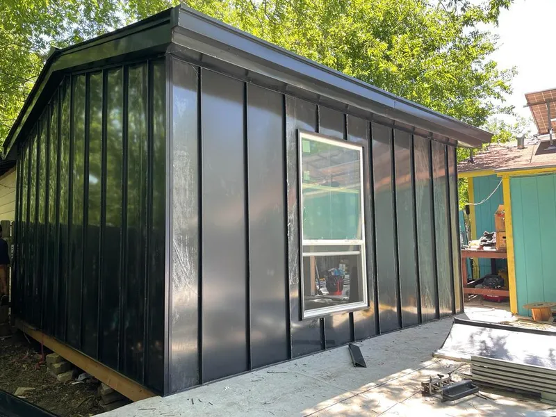 Black standing seam metal wall panels for Roof Inspection in River Vale